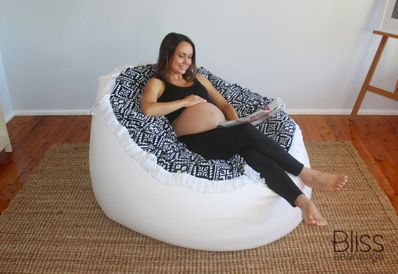 pregnant woman relaxing on pregnancy bean bags