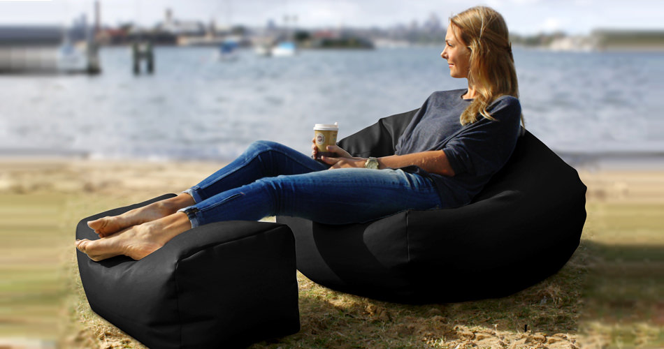 woman enjoying view while sitting on black bean bag